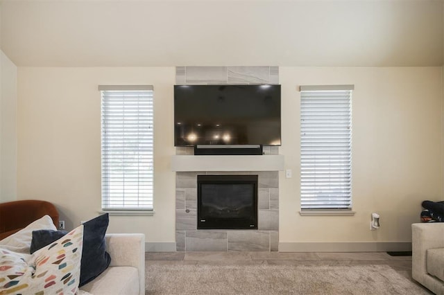 5521 N Miller Ave, Oklahoma City, OK 73112 - living room featuring baseboards and a tiled fireplace