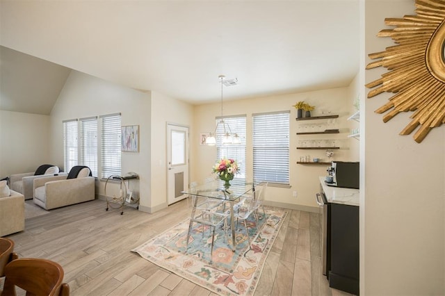 5521 N Miller Ave, Oklahoma City, OK 73112 - dining room with a chandelier, light wood-type flooring, and lofted ceiling