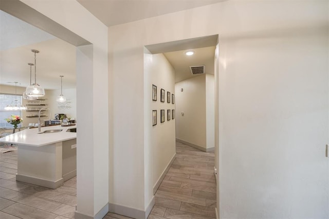 5521 N Miller Ave, Oklahoma City, OK 73112 - hallway featuring a sink and recessed lighting