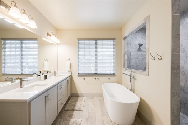 5521 N Miller Ave, Oklahoma City, OK 73112 - bathroom featuring a soaking tub, double vanity, and tiled shower
