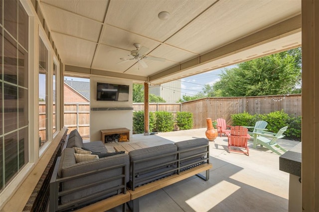 5521 N Miller Ave, Oklahoma City, OK 73112 - fenced backyard with a patio, an outdoor living space with a fireplace, and ceiling fan