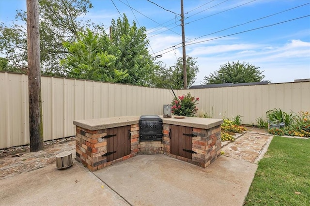 829 Arnold Ave, Moore, OK 73160 - fenced backyard featuring area for grilling and a patio area