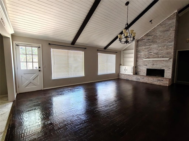 11208 NW 113th St, Yukon, OK 73099 - unfurnished living room featuring built in features, a chandelier, a large fireplace, and wood finished floors