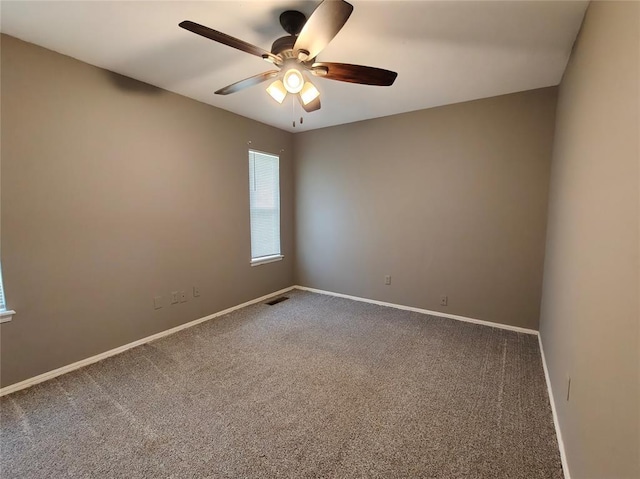 11208 NW 113th St, Yukon, OK 73099 - carpeted empty room featuring ceiling fan and baseboards