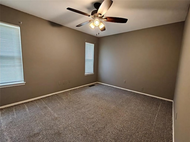 11208 NW 113th St, Yukon, OK 73099 - carpeted spare room with a ceiling fan and plenty of natural light