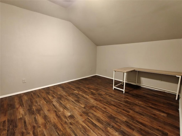 11208 NW 113th St, Yukon, OK 73099 - bonus room with vaulted ceiling and dark wood-type flooring