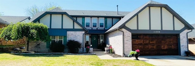 11208 NW 113th St, Yukon, OK 73099 - tudor-style house with brick siding, concrete driveway, a front lawn, stucco siding, and roof with shingles