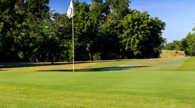 11208 NW 113th St, Yukon, OK 73099 - view of community with a yard, golf course view, and view of scattered trees