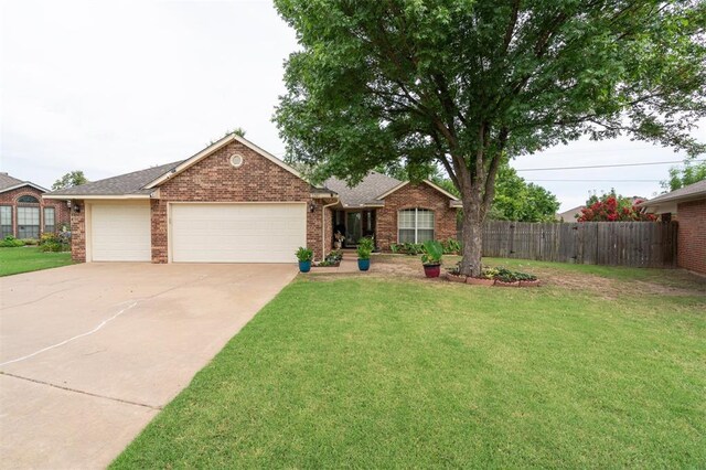 6005 SE 82nd Cir, Oklahoma City, OK 73135 - single story home featuring a garage, concrete driveway, brick siding, and roof with shingles