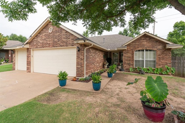 6005 SE 82nd Cir, Oklahoma City, OK 73135 - single story home with a garage, brick siding, concrete driveway, and a shingled roof