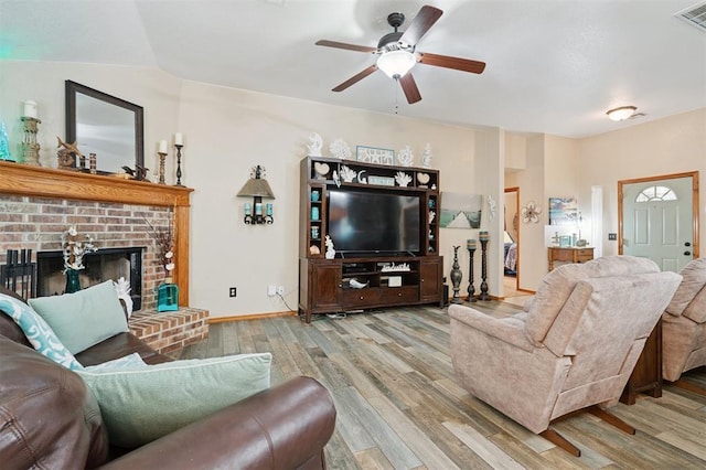 6005 SE 82nd Cir, Oklahoma City, OK 73135 - living room featuring wood finished floors, a ceiling fan, and a fireplace