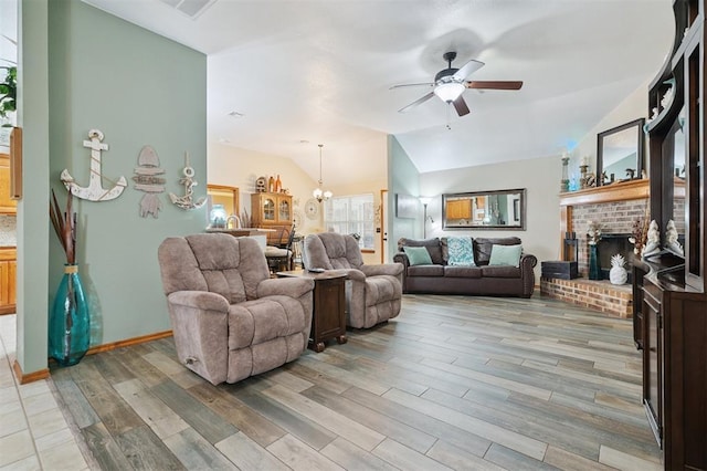 6005 SE 82nd Cir, Oklahoma City, OK 73135 - living room with a ceiling fan, a brick fireplace, light wood-style floors, vaulted ceiling, and a chandelier