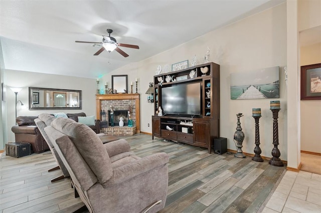 6005 SE 82nd Cir, Oklahoma City, OK 73135 - living room featuring a ceiling fan, vaulted ceiling, wood finished floors, and a brick fireplace