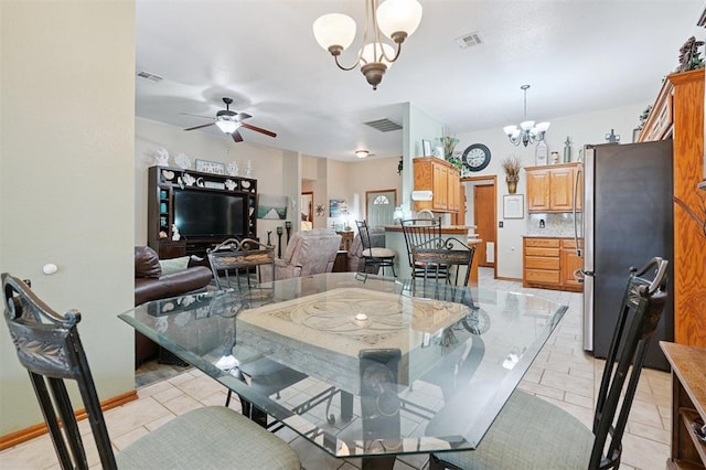 6005 SE 82nd Cir, Oklahoma City, OK 73135 - dining area with a chandelier, ceiling fan, and light tile patterned flooring