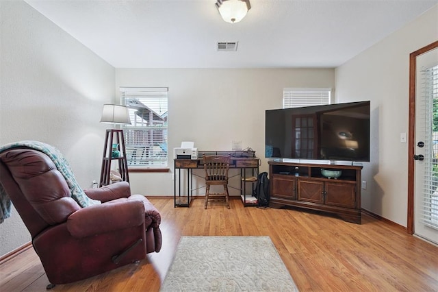 6005 SE 82nd Cir, Oklahoma City, OK 73135 - living room with light wood finished floors and baseboards