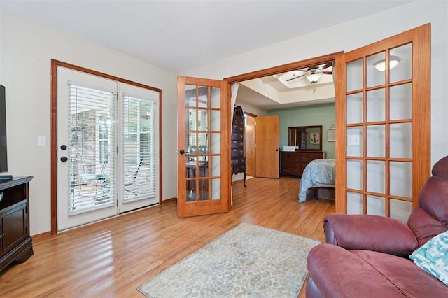 6005 SE 82nd Cir, Oklahoma City, OK 73135 - living area featuring wood finished floors, ceiling fan, and french doors