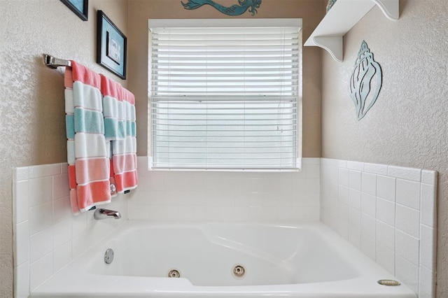 6005 SE 82nd Cir, Oklahoma City, OK 73135 - full bath with a whirlpool tub, plenty of natural light, and a textured wall