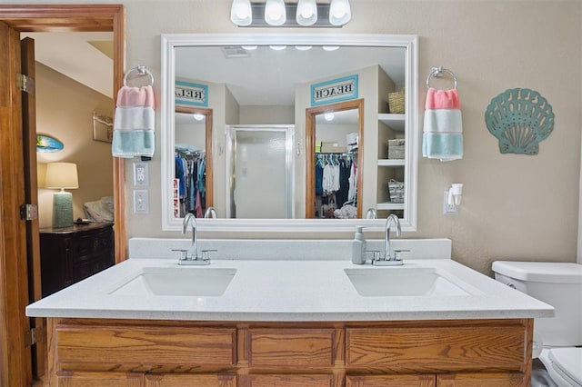 6005 SE 82nd Cir, Oklahoma City, OK 73135 - full bath featuring a walk in closet, a shower stall, and double vanity