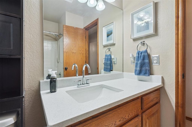 6005 SE 82nd Cir, Oklahoma City, OK 73135 - full bathroom featuring vanity and a textured wall