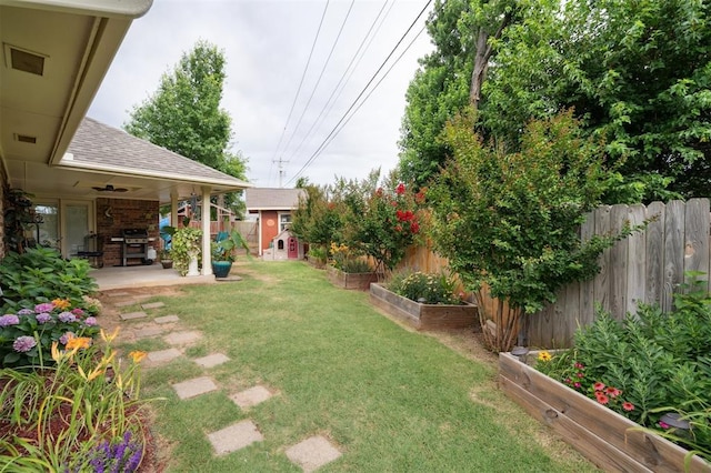 6005 SE 82nd Cir, Oklahoma City, OK 73135 - fenced backyard with a patio area, a vegetable garden, and a storage shed