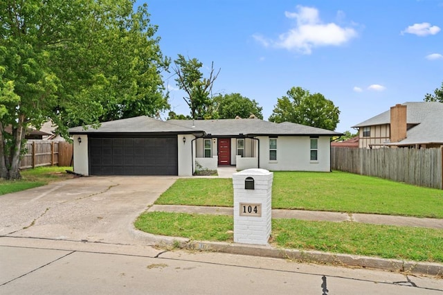104 N Ramblin Oaks Dr, Moore, OK 73160 - view of front of home featuring an attached garage, driveway, and stucco siding