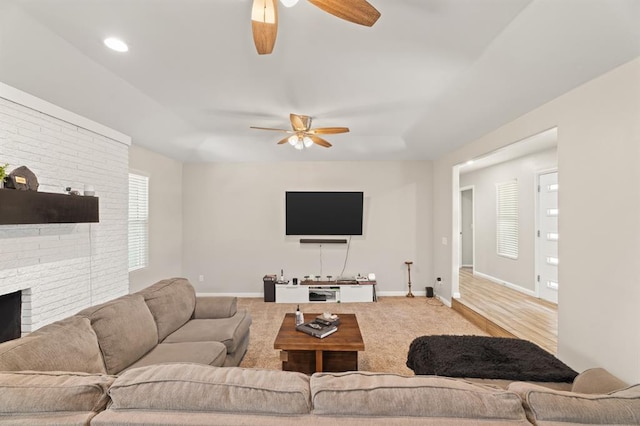 104 N Ramblin Oaks Dr, Moore, OK 73160 - living room with ceiling fan and a fireplace