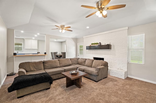 104 N Ramblin Oaks Dr, Moore, OK 73160 - carpeted living room featuring ceiling fan, a brick fireplace, healthy amount of natural light, and recessed lighting