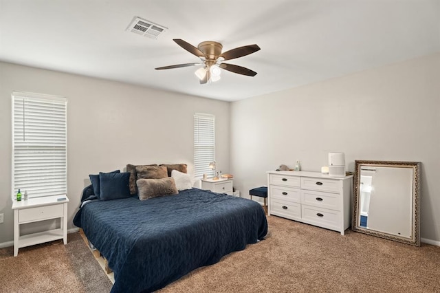 104 N Ramblin Oaks Dr, Moore, OK 73160 - bedroom with light colored carpet and ceiling fan