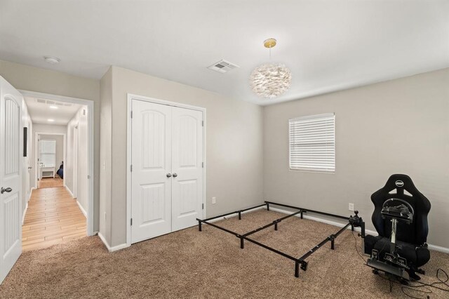 104 N Ramblin Oaks Dr, Moore, OK 73160 - carpeted bedroom with a closet and baseboards