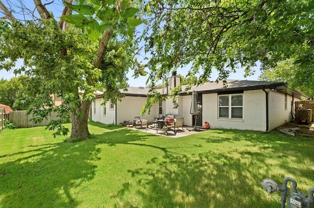 104 N Ramblin Oaks Dr, Moore, OK 73160 - rear view of house featuring a patio area, a chimney, and brick siding