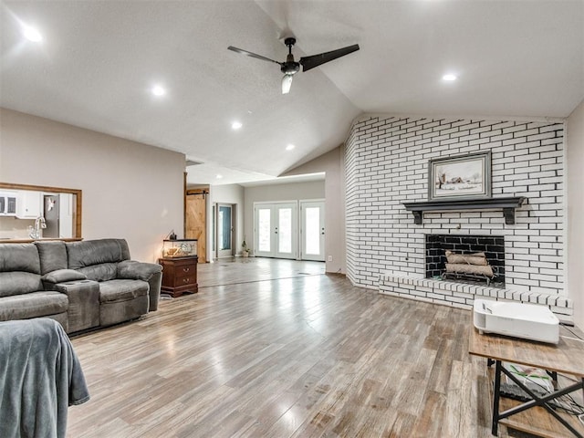 6708 Basswood Canyon Rd, Oklahoma City, OK 73162 - living area with lofted ceiling, ceiling fan, wood finished floors, a fireplace, and recessed lighting