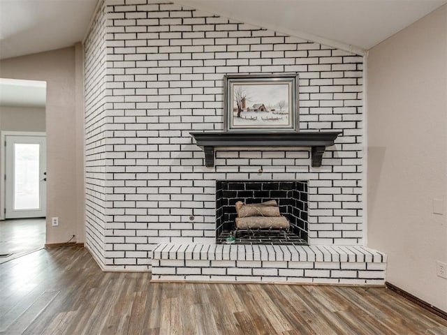 6708 Basswood Canyon Rd, Oklahoma City, OK 73162 - detailed view of wood finished floors and a fireplace