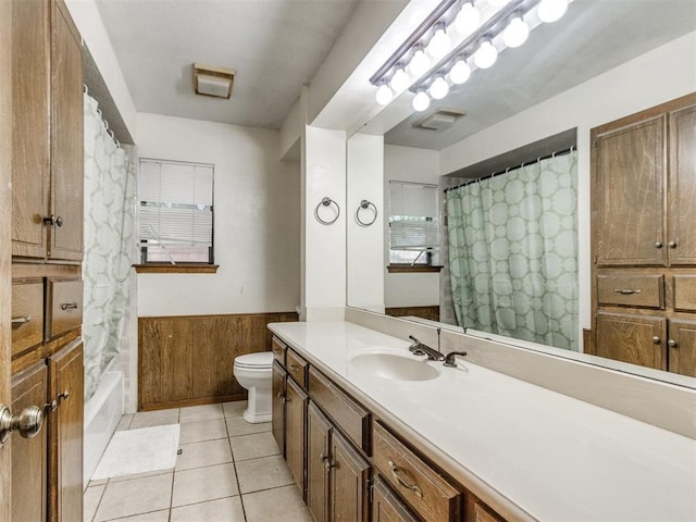 6708 Basswood Canyon Rd, Oklahoma City, OK 73162 - bathroom featuring vanity, a wainscoted wall, tile patterned floors, shower / bath combo, and wooden walls