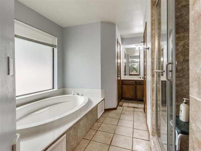 6708 Basswood Canyon Rd, Oklahoma City, OK 73162 - bathroom with vanity, a garden tub, and a shower stall