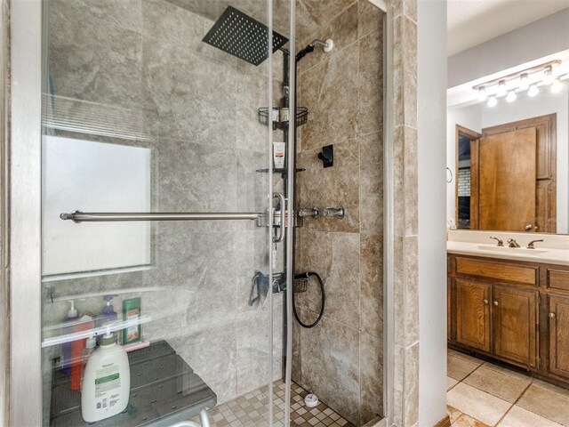 6708 Basswood Canyon Rd, Oklahoma City, OK 73162 - full bath featuring a shower stall, vanity, and tile patterned floors