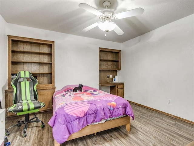 6708 Basswood Canyon Rd, Oklahoma City, OK 73162 - bedroom featuring wood finished floors and ceiling fan