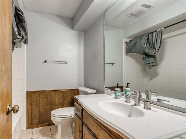 6708 Basswood Canyon Rd, Oklahoma City, OK 73162 - bathroom with a wainscoted wall, vanity,  shower combination, and tile patterned flooring