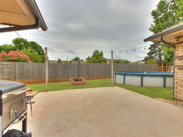 6708 Basswood Canyon Rd, Oklahoma City, OK 73162 - fenced backyard with a patio area and a grill
