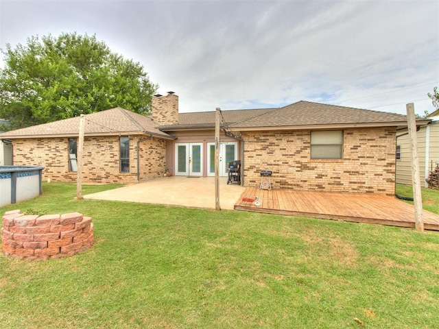 6708 Basswood Canyon Rd, Oklahoma City, OK 73162 - back of house featuring french doors, brick siding, and a wooden deck