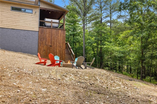 306 Gnarly Maple Trl, Broken Bow, OK 74728 - view of yard with stairway and an outdoor fire pit