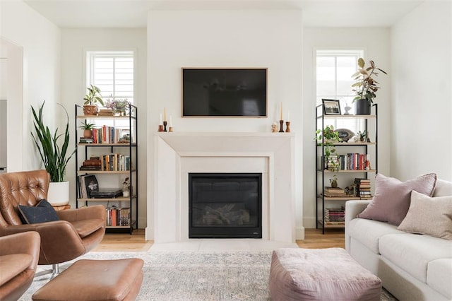 1900 Runway Blvd, Oklahoma City, OK 73108 - living room with a fireplace with flush hearth, plenty of natural light, and wood finished floors