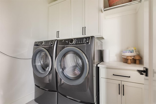 1900 Runway Blvd, Oklahoma City, OK 73108 - laundry area with cabinet space and washer and clothes dryer