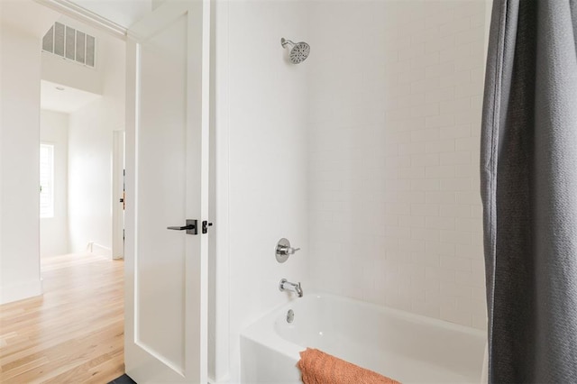 1900 Runway Blvd, Oklahoma City, OK 73108 - full bath featuring shower / bathtub combination with curtain and wood finished floors
