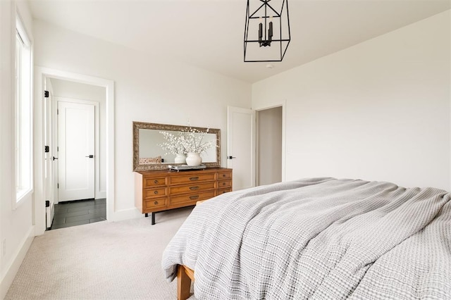 1900 Runway Blvd, Oklahoma City, OK 73108 - bedroom with carpet flooring and a chandelier