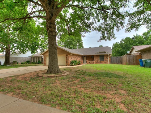 1221 Val Genes Rd, Edmond, OK 73003 - view of front of home featuring driveway, an attached garage, and brick siding