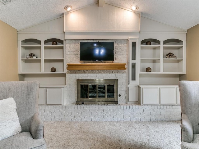 1221 Val Genes Rd, Edmond, OK 73003 - living room with lofted ceiling, a textured ceiling, carpet flooring, and a fireplace