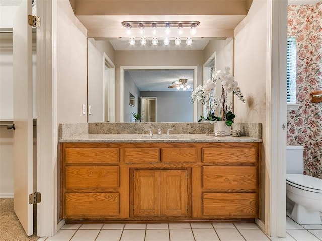 1221 Val Genes Rd, Edmond, OK 73003 - bathroom featuring vanity, wallpapered walls, and ceiling fan