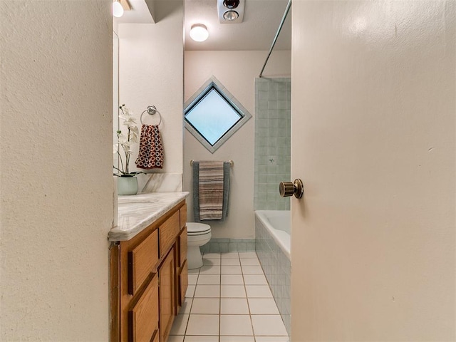 1221 Val Genes Rd, Edmond, OK 73003 - full bathroom featuring vanity, tile patterned flooring, and washtub / shower combination