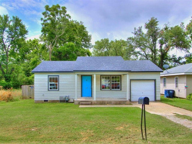 1125 E Fay St, Shawnee, OK 74801 - single story home with concrete driveway, a garage, a front yard, and a shingled roof
