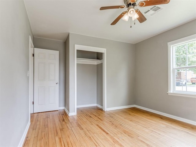 1125 E Fay St, Shawnee, OK 74801 - unfurnished bedroom featuring light wood-type flooring, a closet, and a ceiling fan